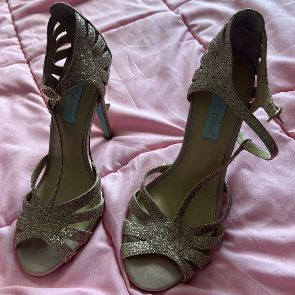 Women’s gold glittery heels